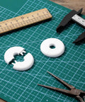 2 Pack Wall Grommets For Cables Pass Through Anti Slip Hole Covers For Walls And Furniture White on cutting mat with tools