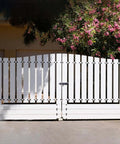 Wooden gate with Heavy Duty 6.3 Inch Gate Latch Barrel Bolt Slide Lock in Solid 304 Stainless Steel and Black Finish, installed on driveway.