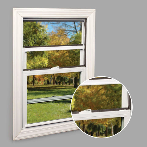 Window with self-stick rubber foam weatherseal, 3/8"W, 3/16"T, black, installed to prevent drafts with outdoor view.