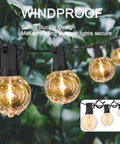 Outdoor hanging lights with windproof safety buckle design, glowing in the rain against a leafy backdrop, emphasizing secure installation.