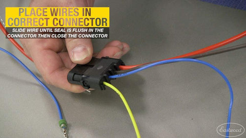 Hand installing wires into connector using Crimp Right Weather Tight Connector Crimping Kit Ferrule Crimper Plier Wire Stripper And Connectors Terminal Crimp Tool Kit For Wiring Projects And Electrical Repairs Ideal For Serious Automotive DIYers.