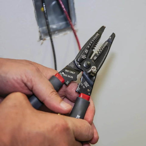 Person using Kurve Wire Stripper Crimper Cutter Multi Tool For 10-26 AWG Solid And 12-28 AWG Stranded Wire near a junction box.
