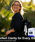 Woman outdoors with backpack holding pack of Individually Wrapped Microfiber Lens Wipes For Glasses Sunglasses And Cameras