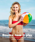 Woman holding a rainbow inflatable beach ball from the 12-Pack 12“ Beach Balls - Bulk Classic Beachball Inflatable Swimming Pool Toys set on the beach.