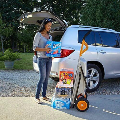 Woman using 8 in 1 Heavy Duty Aerocart Garden Cart Wheelbarrow Dolly with Turbo Lift Design and Flat Free Tires to unload groceries