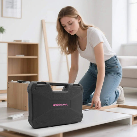 Woman assembling furniture with Pink 69 Piece Tool Kit For Women Portable Hand Tools Set for DIY projects in living room