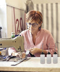Woman using sewing machine with Long Mouth Nozzle Oil Bottles For Sewing Machines And Home Tools Three Pack Plastic Oiler Pots nearby