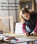 Woman using Pink 263-Piece Home Repair Tool Kit With Wide Mouth Storage Bag For DIY Projects And Breast Cancer Awareness Ribbon