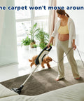 Woman vacuuming rug secured with Heavy Duty Double Sided Carpet Tape 4 Inch By 30 Yard Keeps Rugs In Place On Carpet Hardwood Floors Outdoor Rugs And Stair Treads No Residue Easy To Install White