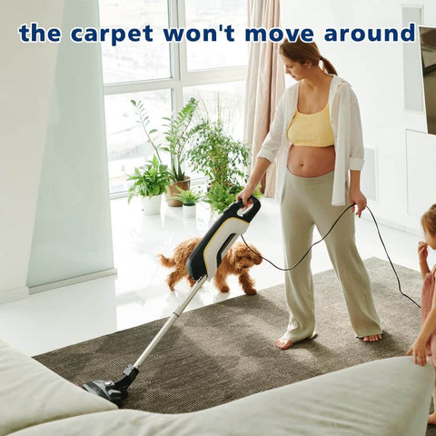 Woman vacuuming rug secured with Heavy Duty Double Sided Carpet Tape 4 Inch By 30 Yard Keeps Rugs In Place On Carpet Hardwood Floors Outdoor Rugs And Stair Treads No Residue Easy To Install White