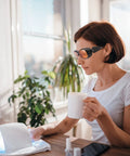 Woman wearing UV Safety Glasses for 90nm-490nm UV Lamps Orange Lenses Anti-Glare Anti-Fog while using a UV lamp indoors