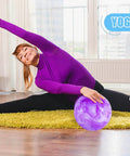 Woman doing yoga with purple ball from 3 otters 6PCS Playground Balls, 8.5 Inches Beach Ball for Kids Inflatable Bouncy Balls
