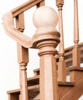 Two Pack Two And A Half Inch Round Wood Ball Curtain Rod Finials With Pre Installed Screws Wood Newel Post Caps Decorative Bed Post Finials For Curtains DIY Projects And Home Decor installed on a wooden staircase post