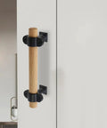 Adjustable Wood Cabinet Handles Set Of 4 With Screws for drawers and wardrobes, modern double hole furniture pull installed on door.