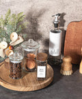 Wood lazy susan organizer kitchen turntable, 10 inch round decorative farmhouse tray in brown with jars and utensils.