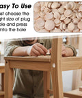 120 Piece Wood Plug Set For Screw Holes With Mushroom Head Shape in various sizes installed in wooden furniture, front view