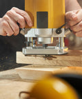 Craftsman using Five Sixteenth Inch Internal Threaded Clamping Knobs for T Track Jigs and Fixtures in routing setup