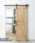 Natural wood door installed with 5 FT Heavy Duty Sturdy Sliding Barn Door Hardware Kit, Black, including handle and floor guide, I Shape Hanger.
