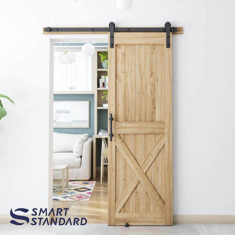 Natural wood door installed with 5 FT Heavy Duty Sturdy Sliding Barn Door Hardware Kit, Black, including handle and floor guide, I Shape Hanger.