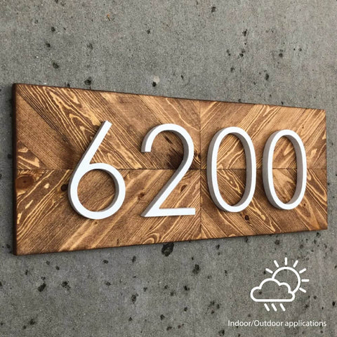 Wooden address plaque with number 6200 mounted on a wall, suitable for indoor or outdoor applications, with weather icons.