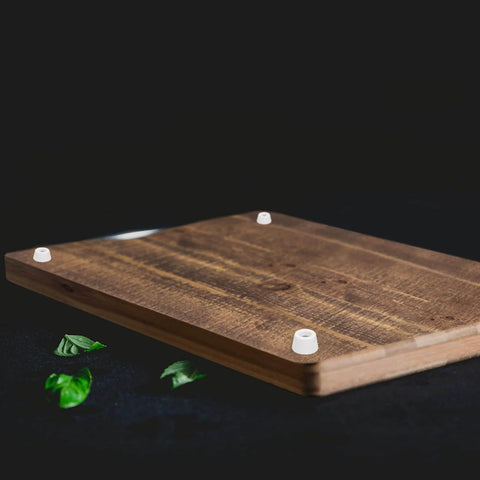 Wood surface with installed 12 Pack Rubber Bumper Feet 0.35 In High By 0.55 In Wide Round Pads, preventing damage and slippage.