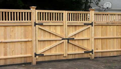 Wooden gate with Heavy Duty Gate Hinges 900 Lbs Capacity - 13" Bolt-On or Weld-On Hinges installed, outdoors view