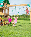 Children playing on a playground set with swings and slide, showcasing 6 Pack Wood Beam And I Beam Hanger Set Stainless Steel Permanent Anti Rust.