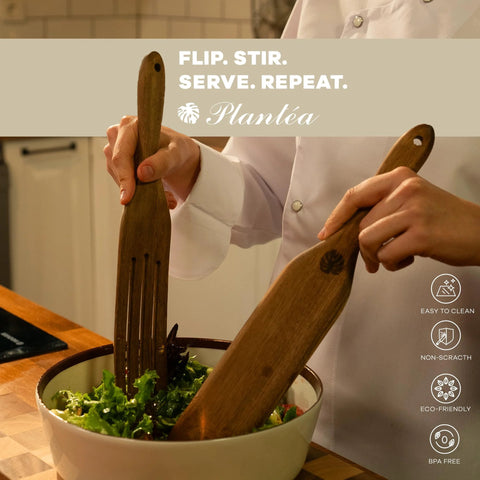 Person using Spurtle Kitchen Tools Wooden Set for Nonstick Cookware, stirring salad with wooden spurtles, in kitchen setting