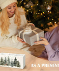 Two people exchanging a gift with a Christmas Tree Wooden Utensils Holder, Farmhouse Xmas Reindeer Winter Forest Landscape design.