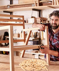 Carpenter using solid pine pocket hole plugs on wooden furniture in workshop, Premium Solid Pine Pocket Hole Plugs Pack Of One Hundred Twenty Pieces Three Eighth Inch Diameter For Screw Holes And Pocket Hole Jigs Woodworking For Diyers And Pros With A Smooth Conical Design For A Clean Seamless And Durable Finish visible in foreground.