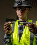 Person holding 7 In 1 Flip Socket Set For Impact Drivers With Handle And Bit Holder By Klein Tools, wearing safety gear