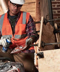 Worker using Heavy Duty Lubricating Oil For Tools And Machinery 11 Oz on machinery in workshop