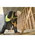 Worker using lightweight corded SDS rotary hammer with Active Vibration Control delivers 3.0 J impact energy and an 8.5 A motor.