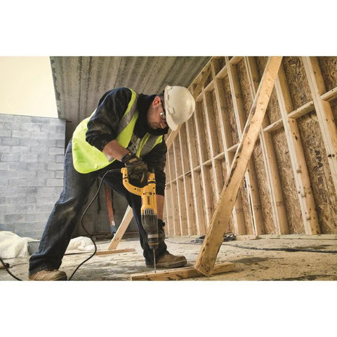Worker using lightweight corded SDS rotary hammer with Active Vibration Control delivers 3.0 J impact energy and an 8.5 A motor.