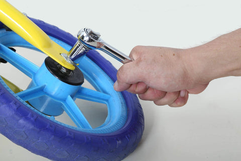Adjusting bicycle wheel bolt using 121 Piece Mechanic Tool Set With One Quarter And Three Eighth Inch Drive Sockets