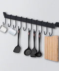 Wrought Iron Kitchen Holder: 10-Hook Wall-Mounted Utensil Rack with Black Finish holding mugs and kitchen tools