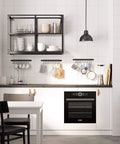 Modern kitchen with white cabinets and a black 17-inch Gourmet Kitchen Rail with 10 hooks for utensils and organization.