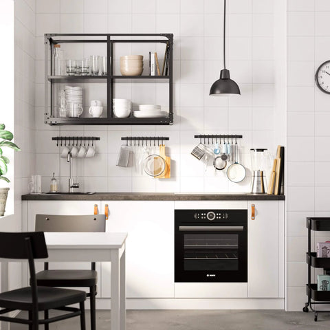 Modern kitchen with white cabinets and a black 17-inch Gourmet Kitchen Rail with 10 hooks for utensils and organization.