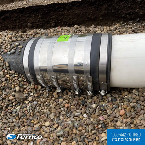 XL Shielded Flexible Pipe Coupling For Below Ground Install Extra Long 7.85 Inch Body Fits Outside Diameter 4.10 To 4.65 Inches Compatible With Cast Iron PVC Lead Steel DWV Sewer Drain installed underground.