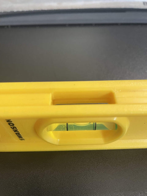 Close-up of Swanson Tool TL011, 9 Inch Speedlite Torpedo Level Yellow Built With High Impact Composite For Tough Jobsite Use Non Conductive Design.