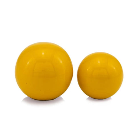 Yellow decorative orbs in two sizes, glossy finish, ideal for modern tabletop decor and centerpieces.