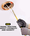 Person using Fifty Foot Fiberglass Fish Tape Running Wire Cable Rods to pull wires through a ceiling conduit with gloved hands.