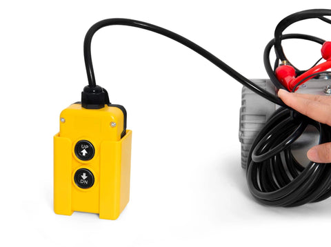 Close-up of a yellow remote control and wires for the Hydraulic Pump 12V Dump Trailer Pump - Hydraulic Power Unit Double Acting Electric Hydraulic Pump