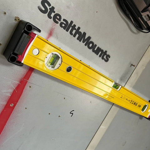 Yellow level on StealthMounts using universal level holder 2 pack