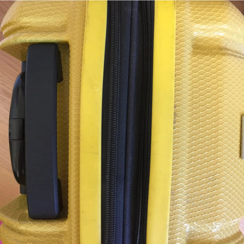 2 Pieces Luggage Replacement Handle Pulls In Flexible Black Plastic attached to a yellow suitcase