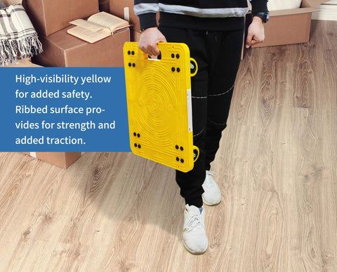 Person holding High Visibility Yellow 300-lb Capacity Movers Dolly with 4 Swivel Casters, 19-1/2" x 14-1/2" Platform