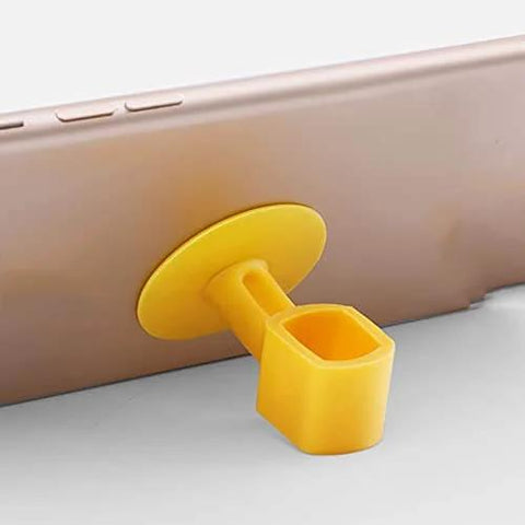 Yellow silicone phone stand holder attached to the back of a smartphone, displaying its simple and functional design.