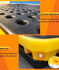 Close-up of black textured surface and drain port of Two Drum Spill Containment Pallet, Polyethylene Low Profile Paint Bucket Tray, Yellow 2 Pack.