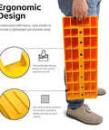 Person holding bright yellow Three Step RV Leveling Ramps Set Of Two for Camper and Trailer in vertical position