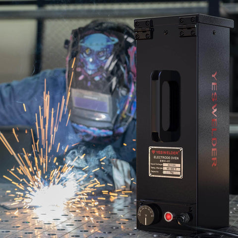 Portable Welding Rod Oven For Stick Electrodes 15Lb Capacity 110V Temperature Controlled 85 To 300 Fahrenheit Fits 14 Inch Rods Moisture Protection Electrode Oven By YesWelder with welder in background.